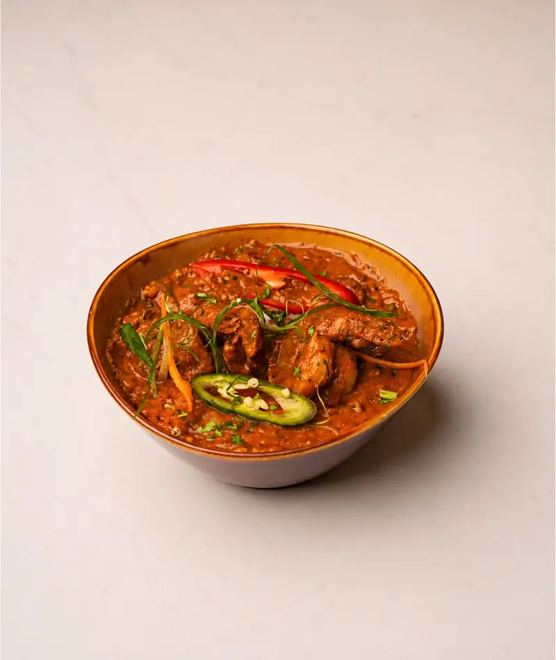 Spiced curry with green chilli and capsicum in a bowl